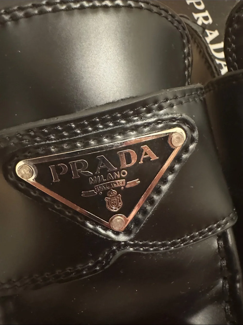 Prada women’s Black Leather Slide Loafers with Triangle Logo